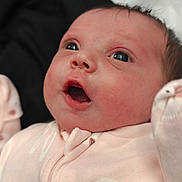 Roseana joined the competition — help win amazing prizes! baby, infant, face, eyes, pink_onesie, clothing, cute, expression, closeup, newborn, soft_lighting, portrait, child, skin, mouth_open, animal_print, adorable, person, baby_garment, indoors