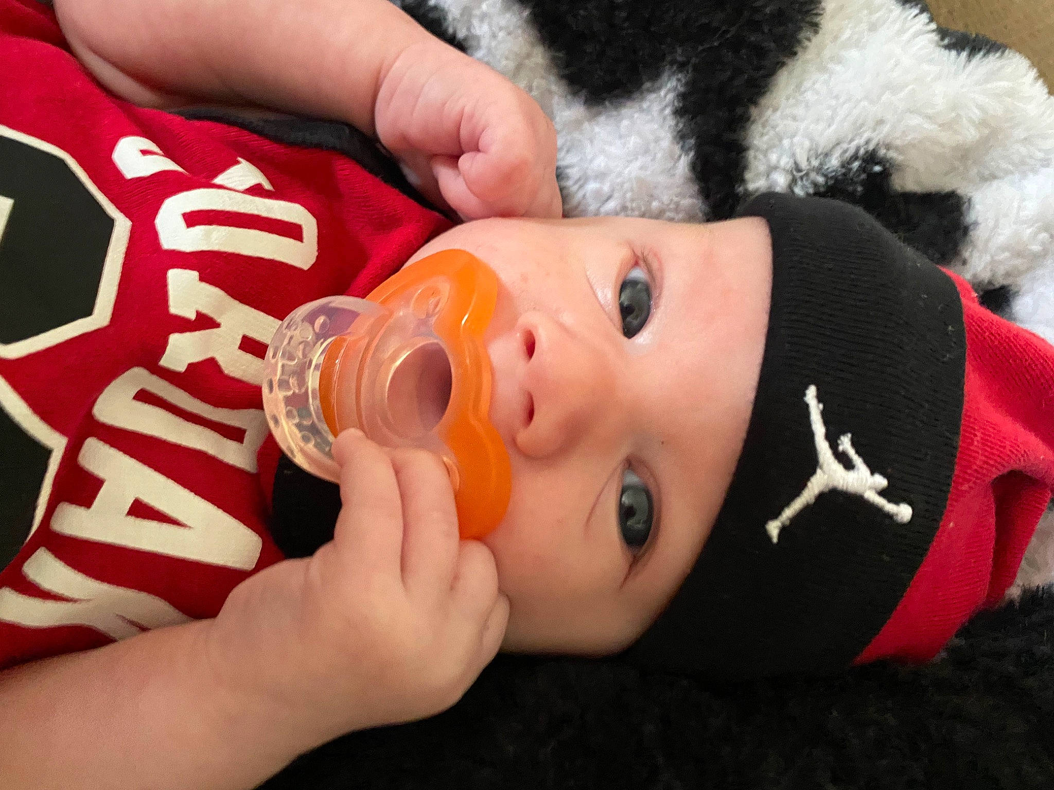 Kingston is registered to the contest to win money with this photo: baby, baby_bottle, bottle, cheek, doll, drinking, drinkware, eyebrow, eyelash, face, finger, hand, headwear, mouth, nail, nose, person, plastic_bottle, skin, stuffed_toy