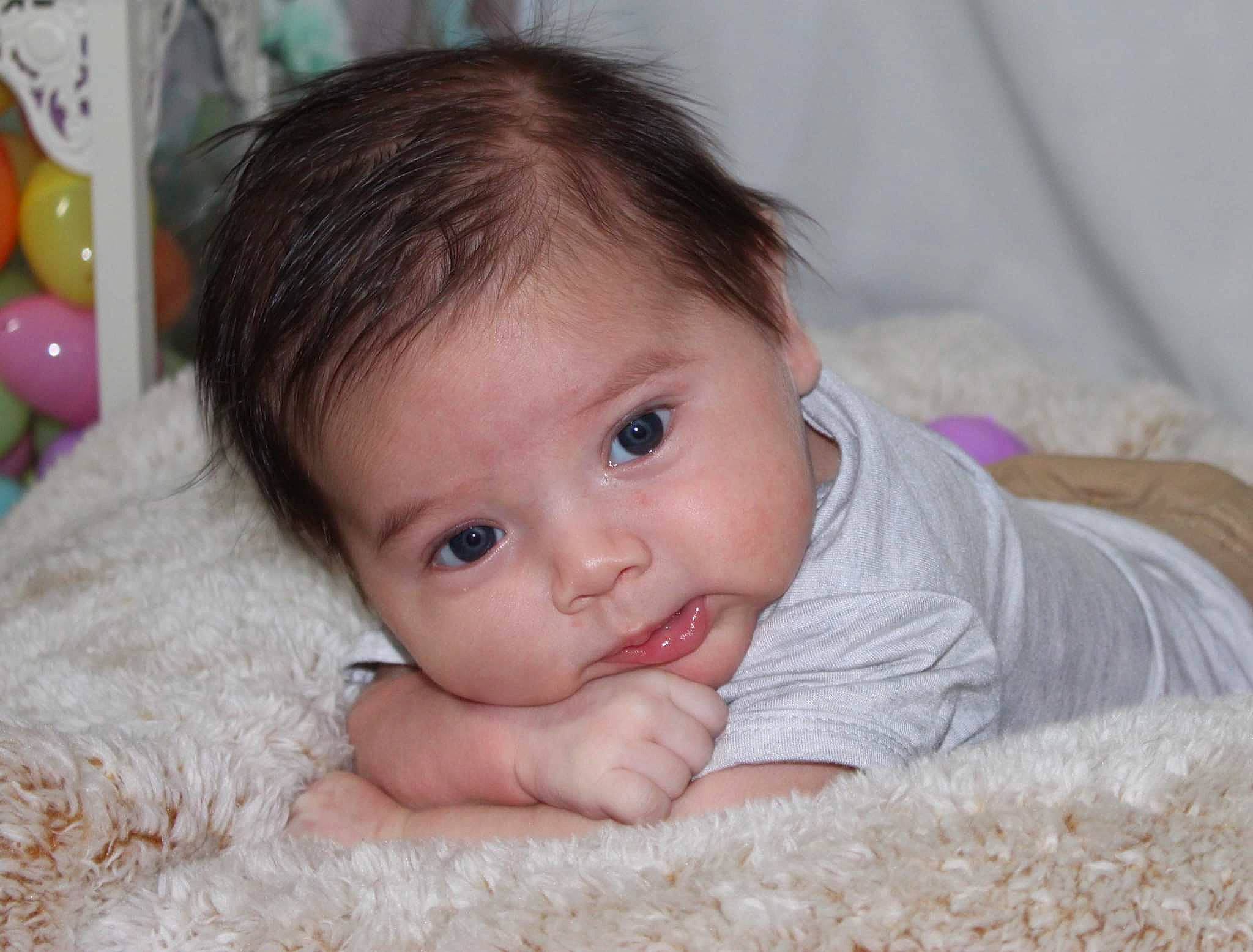 Ayven is registered to the contest to win money with this photo: baby, baby_toddler_clothing, cheek, child, comfort, eye, eyelash, flooring, grass, hair, happy, iris, lip, nose, person, skin, smile, textile, toddler, tummy_time