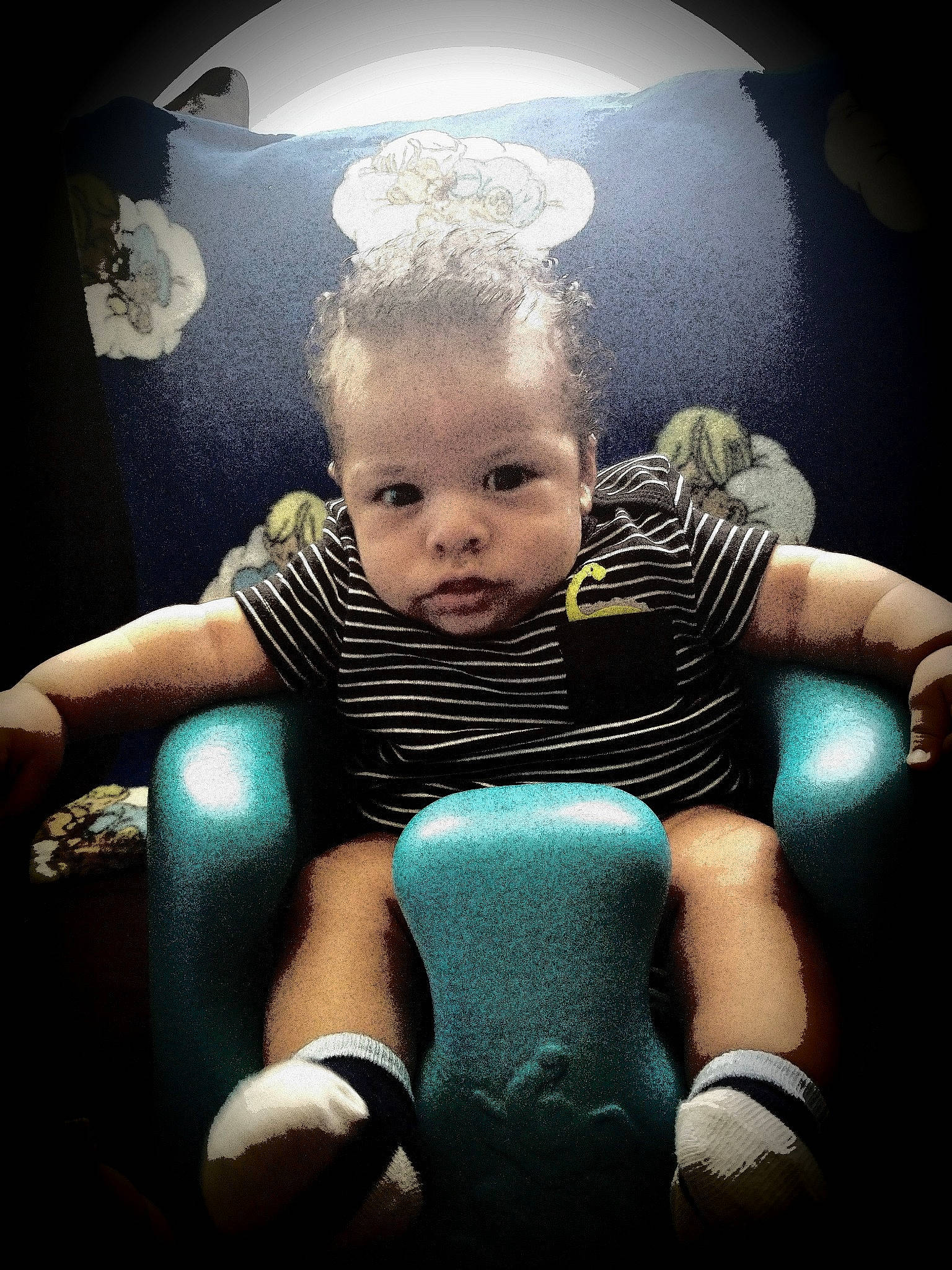 Ozias is registered to the contest to win money with this photo: baby, boxing_glove, chair, cheek, child, cloud, cool, eye, face, flash_photography, fun, head, joint, male, person, photography, play, sitting, sky, toddler