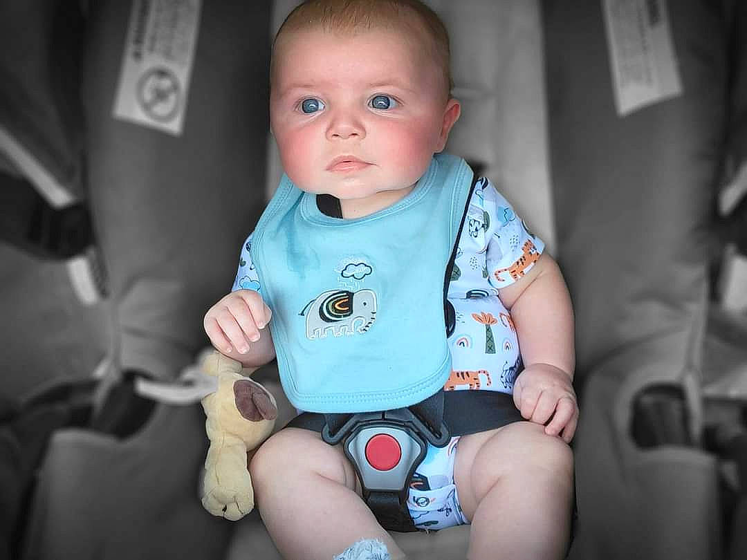 Axel joined the competition — help win amazing prizes! auto_part, baby, baby_products, baby_toddler_clothing, cheek, child, comfort, electric_blue, eye, fun, happy, head, human_leg, knee, person, seat_belt, sitting, skin, sleeve, thumb
