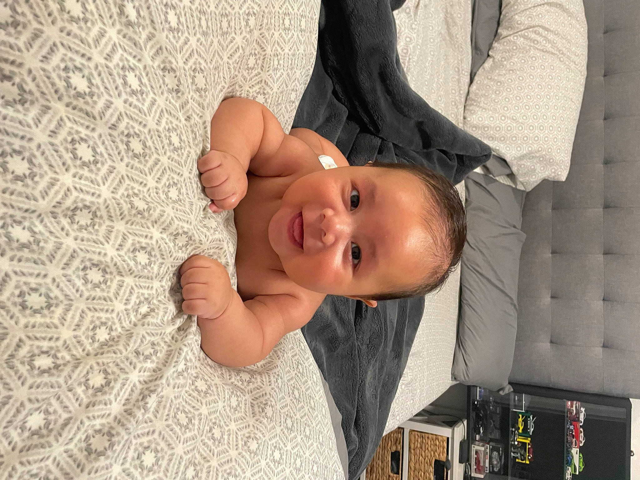 Leonardo is registered to the contest to win money with this photo: baby, baby_toddler_clothing, child, comfort, eye, flash_photography, flooring, fun, gesture, hairstyle, happy, joy, linens, nail, pattern, person, skin, smile, textile, thumb