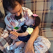Kaliyah joined the competition — help win amazing prizes! arm, baby, beard, casual, child, clothing, comfort, couch, curious, family, headband, holding, indoor, interaction, love, man, paint_splatter, plaid, seated, smile