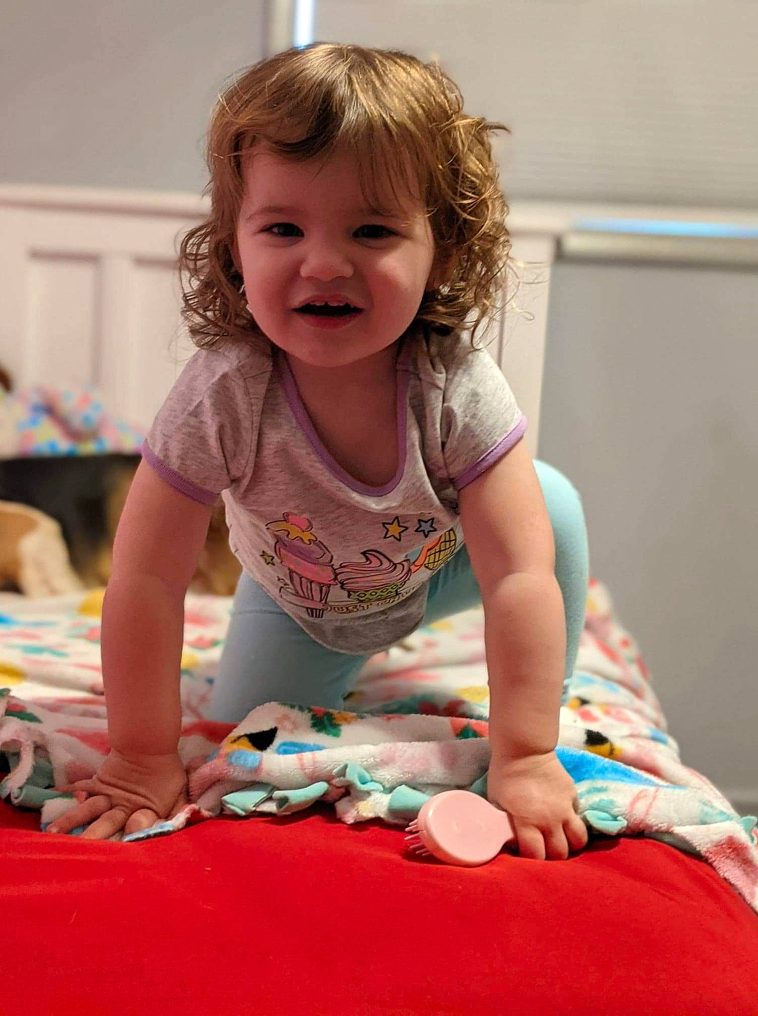 Piper joined the competition — help win amazing prizes! baby, baby_toddler_clothing, child, comfort, face, facial_expression, flooring, fun, hairstyle, happy, knee, leg, leisure, person, pink, sitting, skin, sleeve, smile, t_shirt