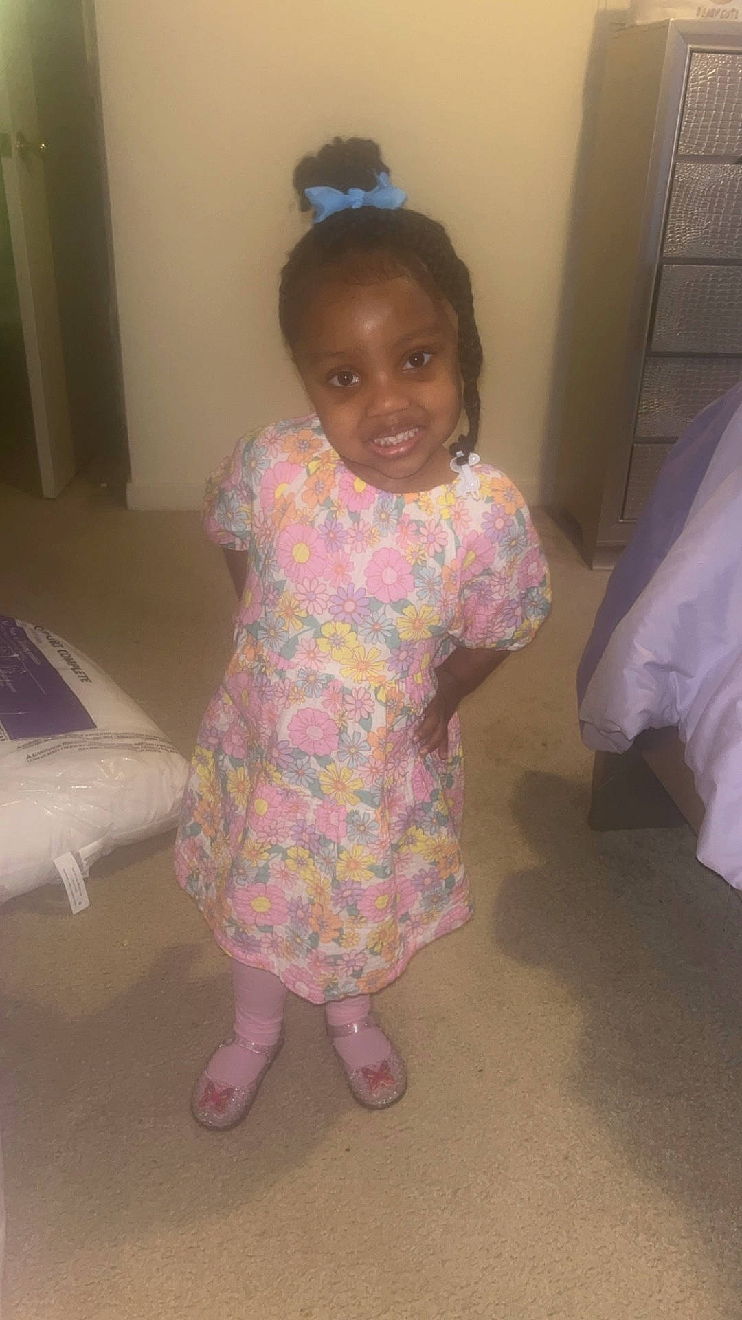 Galiyah is registered to the contest to win money with this photo: bed, bedroom, child, clothing, cushion, door, dress, face, female, footwear, furniture, girl, head, homedecor, indoors, person, photography, portrait, room, shoe