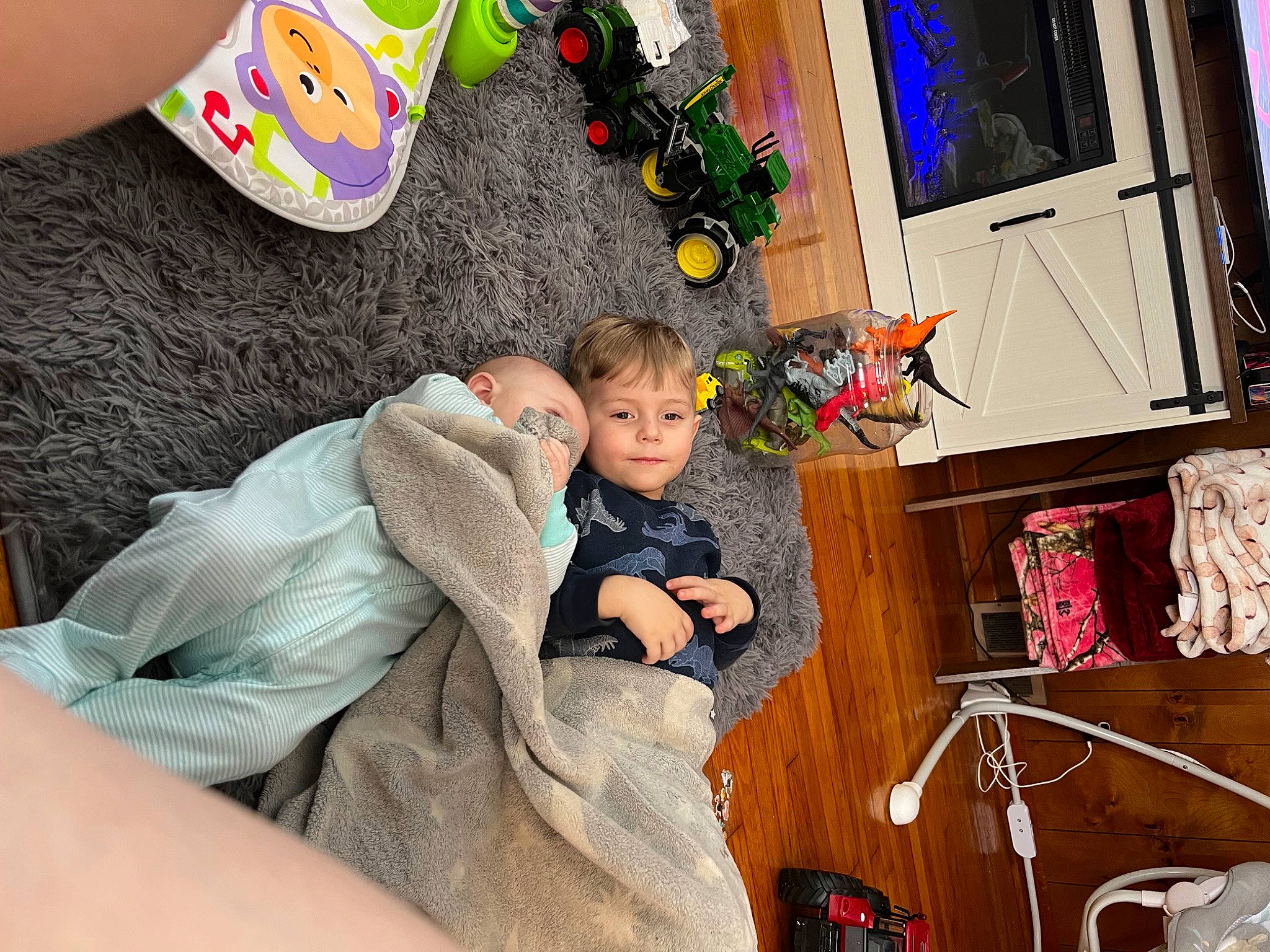 Damian is registered to the contest to win money with this photo: baby, baby_products, child, comfort, couch, event, fun, happy, holiday, human_body, lap, leisure, person, play, room, sitting, sock, stuffed_toy, toddler, toy