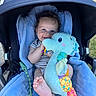 baby, blue_blanket, child, clothing, comfort, cute, face, feet, grass, happy, head, infant, outdoor, pacifier, person, plush_toy, seahorse, smiling, stroller, toy