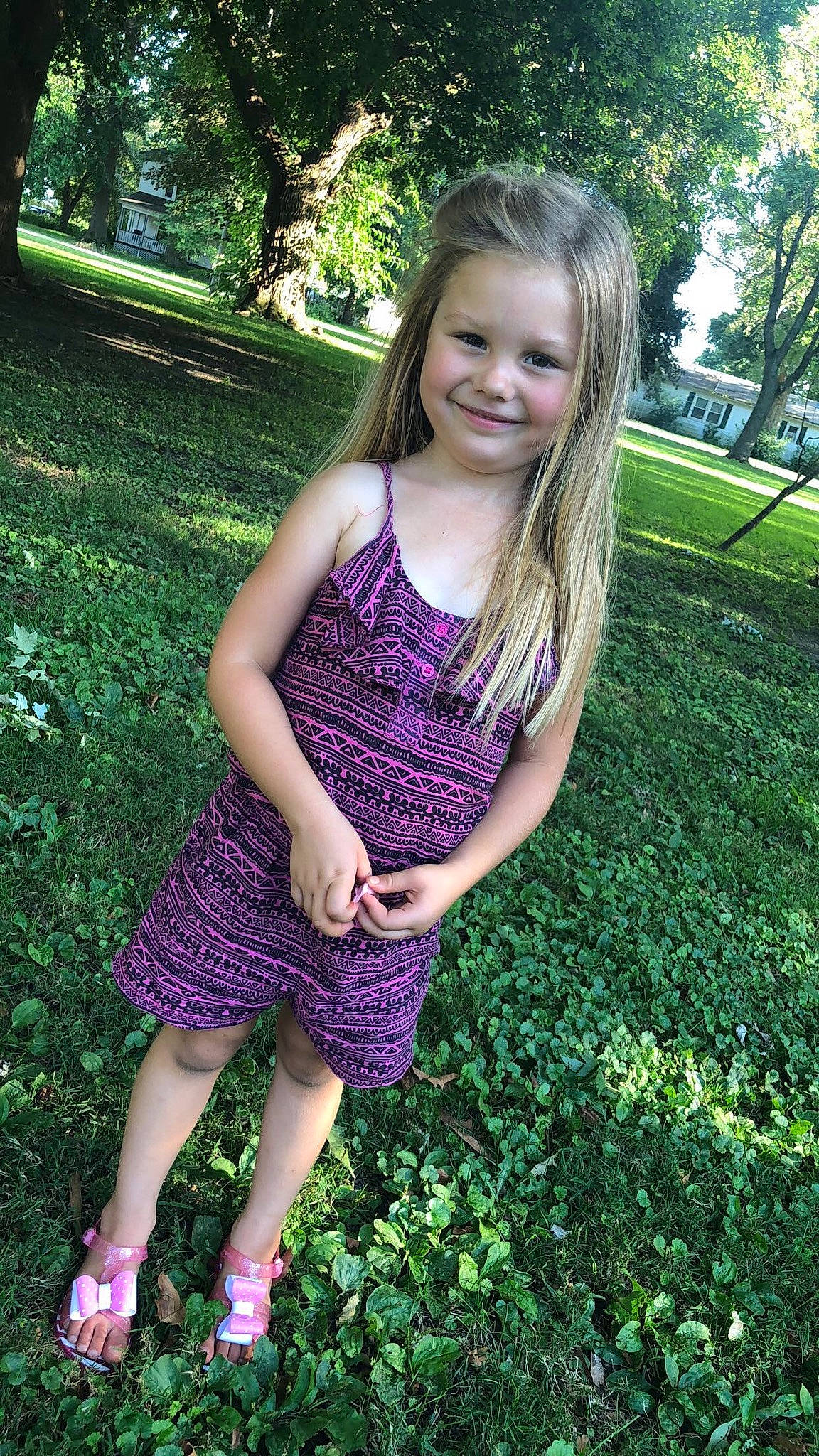 Josie is registered to the contest to win money with this photo: beauty, blond, botany, brown_hair, child_model, clothing, dress, fawn, grass, green, joy, lavender, long_hair, pattern, person, plant, purple, smile, spring, summer