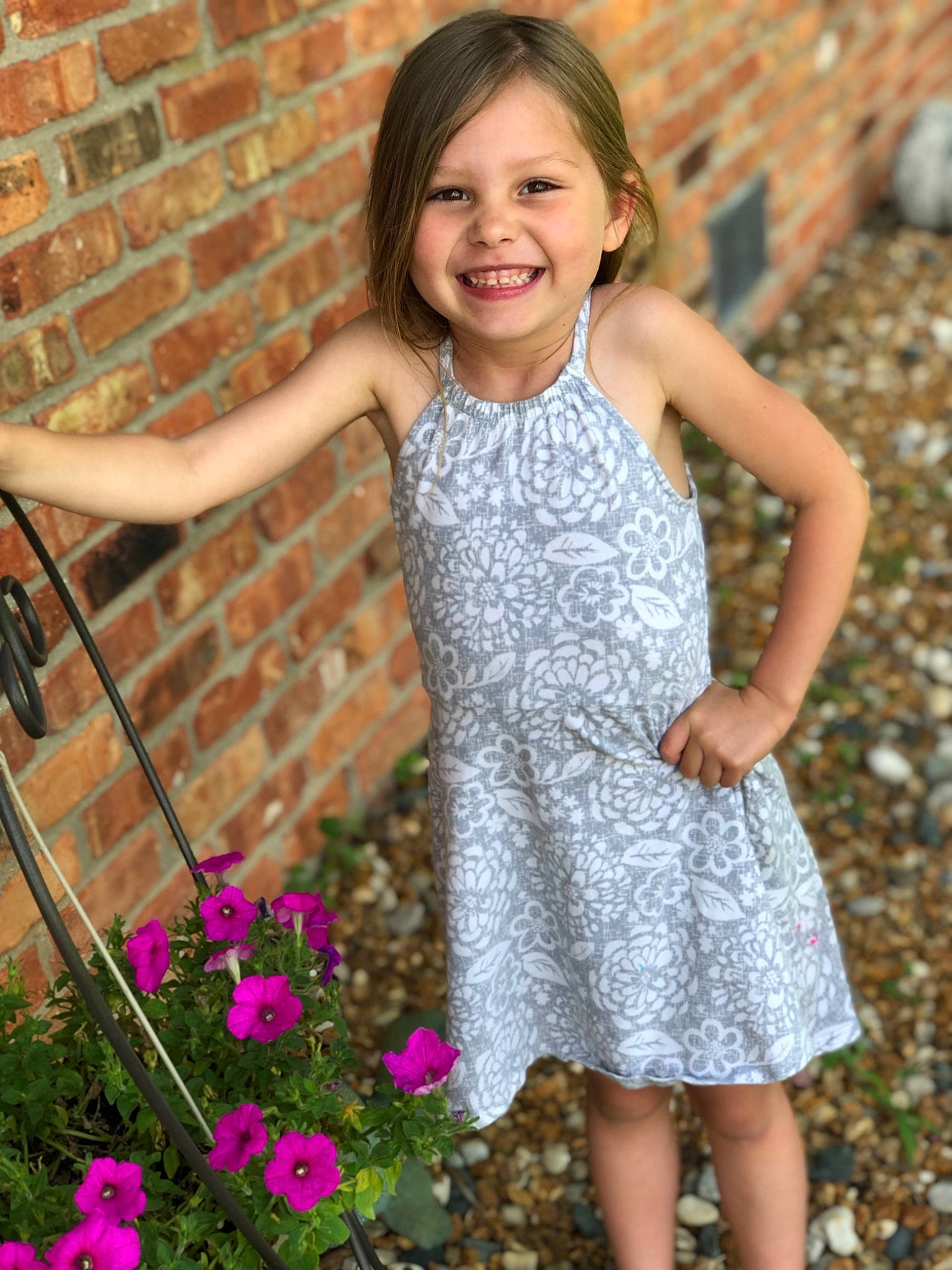 Josie is registered to the contest to win money with this photo: child, child_model, clothing, dress, flower, grass, happy, joy, long_hair, pattern, person, photography, pink, plant, smile, spring, toddler, wildflower
