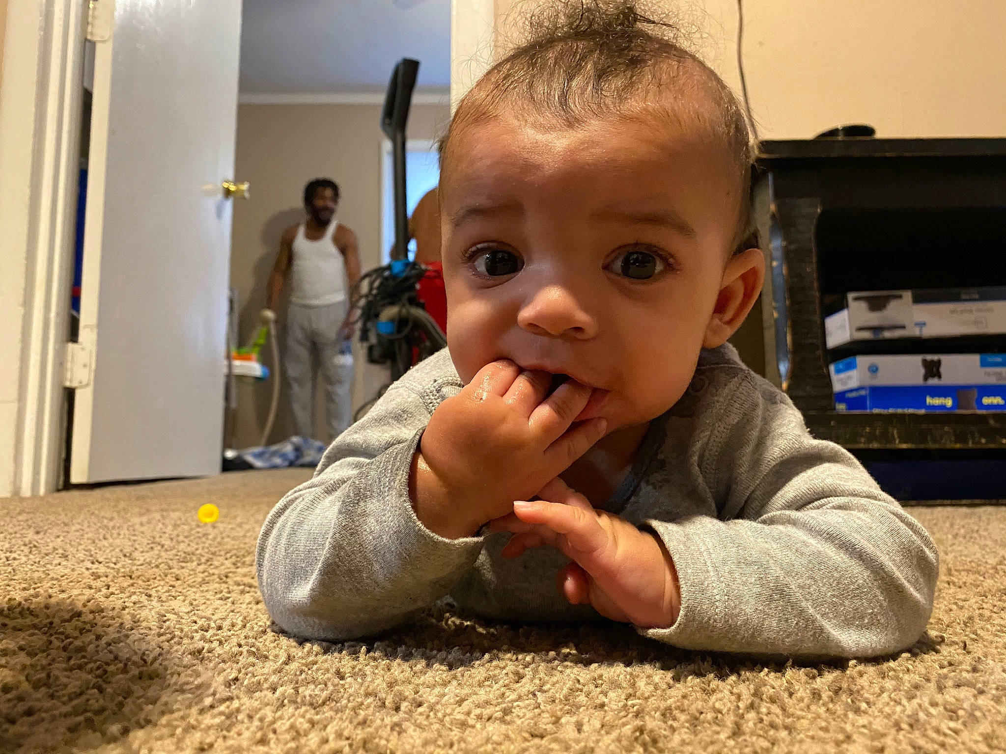 Jaxen is registered to the contest to win money with this photo: baby, cheek, child, crawling, ear, eye, face, facial_expression, finger, floor, flooring, hand, head, mouth, nose, person, play, skin, smile, toddler
