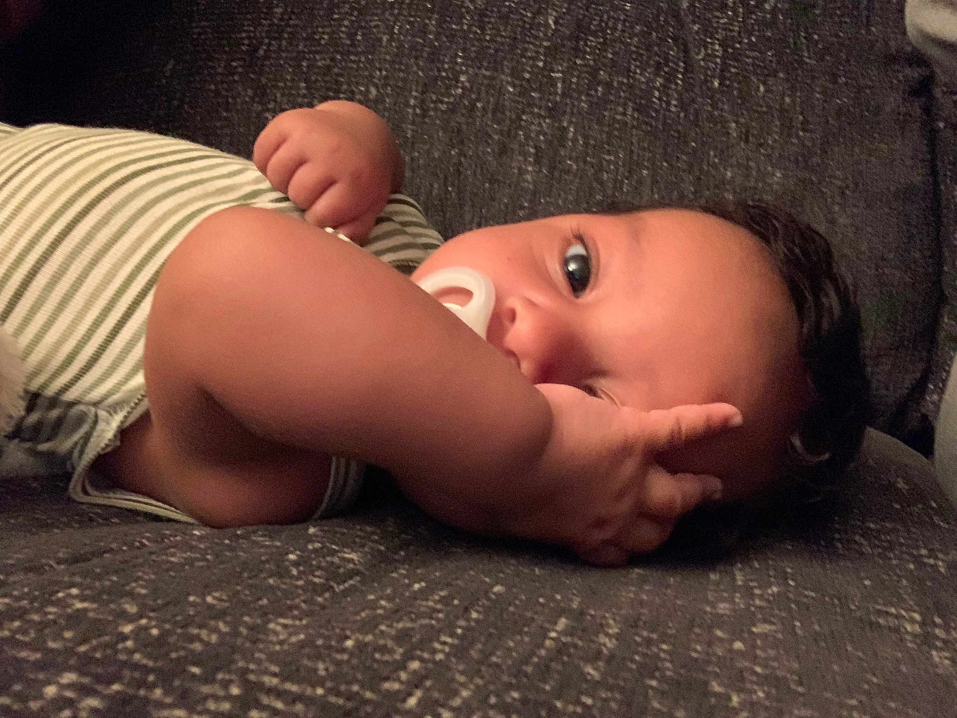 Mateo is registered to the contest to win money with this photo: baby, bed, bedroom, bodypart, couch, cushion, face, finger, furniture, hand, happy, head, homedecor, indoors, newborn, person, photography, portrait, sleeping, smile