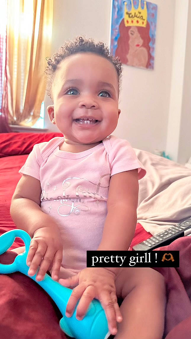 Remi joined the competition — help win amazing prizes! baby, baby_playing_with_toys, baby_toddler_clothing, blue, cheek, curtain, eye, face, finger, fun, hairstyle, happy, head, iris, joy, mouth, person, pink, product, skin