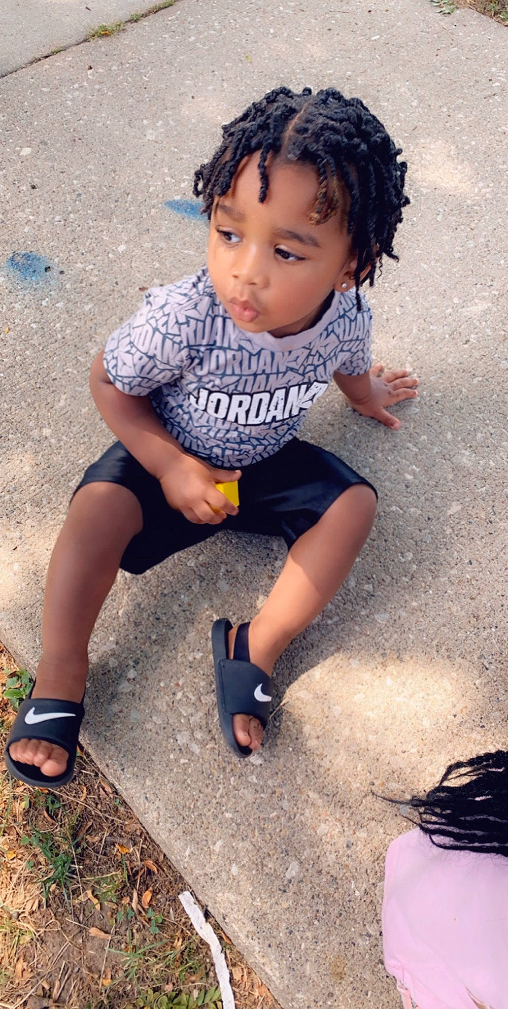 Kennie is registered to the contest to win money with this photo: beauty, black_hair, child, child_model, cool, footwear, fun, leg, person, photography, play, shoe, sitting, skin, smile, snapshot, t_shirt, toddler