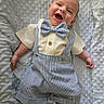 Charlie joined the competition — help win amazing prizes! baby, infant, smiling, bow_tie, striped, suspenders, shorts, clothing, happy, cute, lying_down, blanket, textured, soft, skin, face, portrait, child, newborn, feet