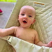 Wyatt joined the competition — help win amazing prizes! baby, infant, child, seat, strap, padded, smiling, open_mouth, skin, bare_chest, diaper, indoor, daylight, comfort, cute, portrait, happy, face, head, person