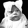 adorable, baby, black_and_white, bow, child, close_up, clothing, cute, expression, eyes, face, headband, infant, monochrome, newborn, person, portrait, soft_texture, studio, young