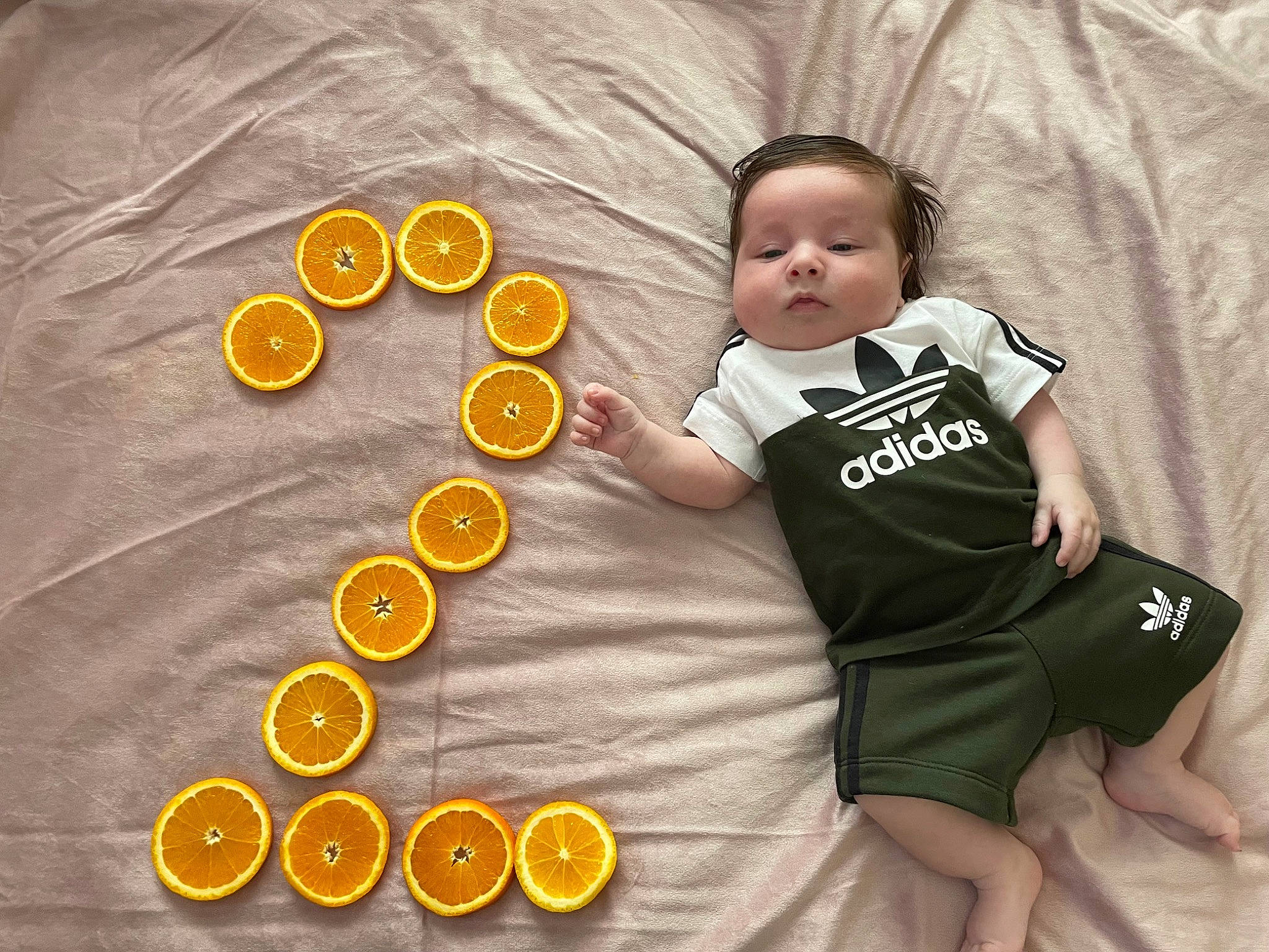 Filip joined the competition — help win amazing prizes! baby, baby_toddler_clothing, button, child, circle, comfort, facial_expression, fashion_accessory, finger, font, happy, linens, orange, outerwear, pattern, person, product, sleeve, t_shirt, toddler