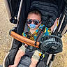Ethan Zaid is registered to the contest to win money with this photo: baby, stroller, sunglasses, pacifier, fan, clothing, shorts, child, summer, outdoor, toddler, seatbelt, toy, foot, headwear, person, cute, fashion, accessory, shade