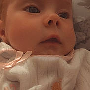 Amina Isla joined the competition — help win amazing prizes! baby, child, close_up, clothing, cozy, cute, expression, eyes, fabric, face, indoors, infant, newborn, pink_bow, portrait, skin, sleepwear, soft_light, warm_tone, young