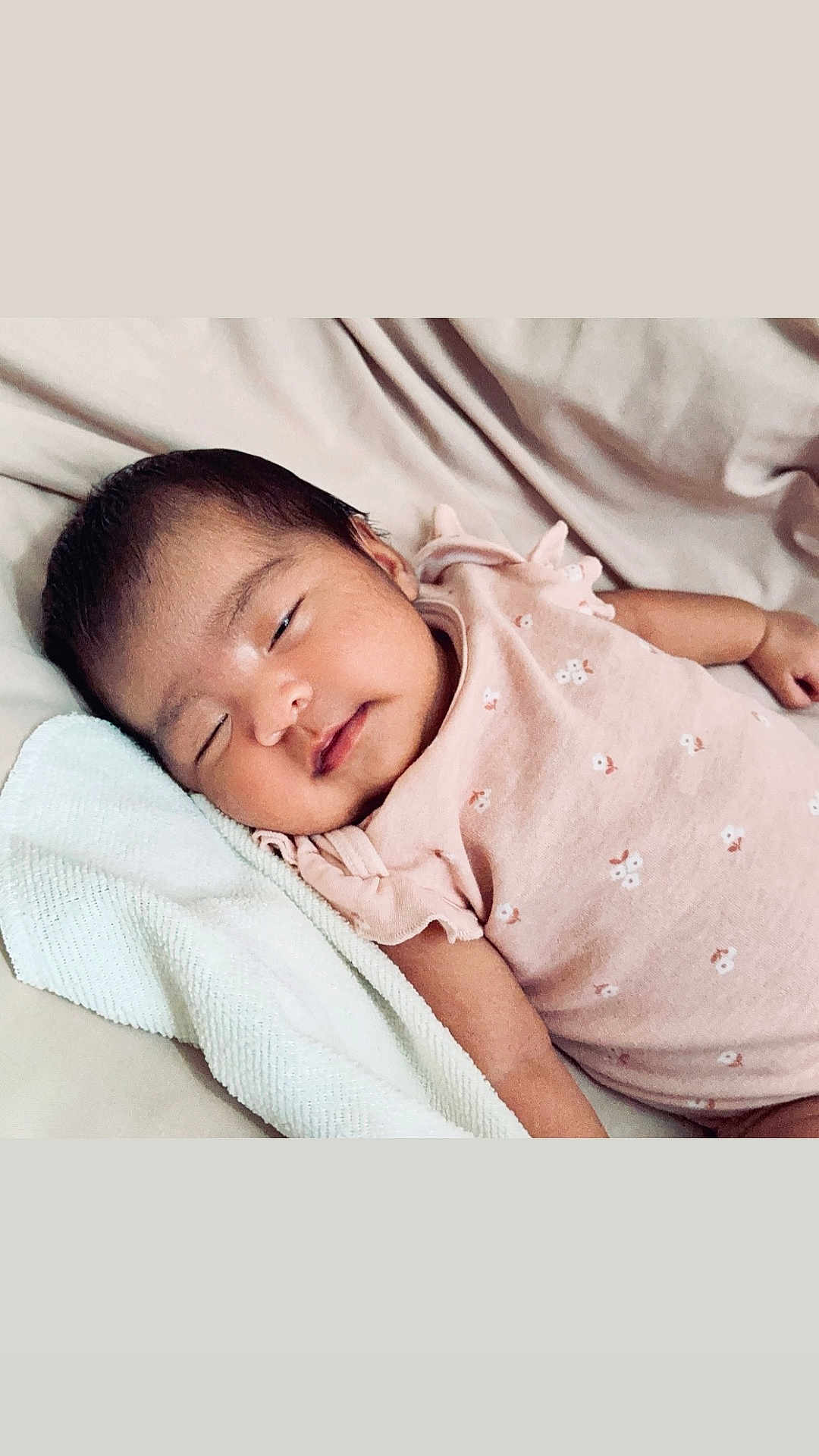 Ailany joined the competition — help win amazing prizes! baby, sleeping, infant, pink_clothing, towel, resting, face, peaceful, soft_texture, close_up, laying_down, newborn, cute, skin, head, arm, person, indoors, calm, portrait