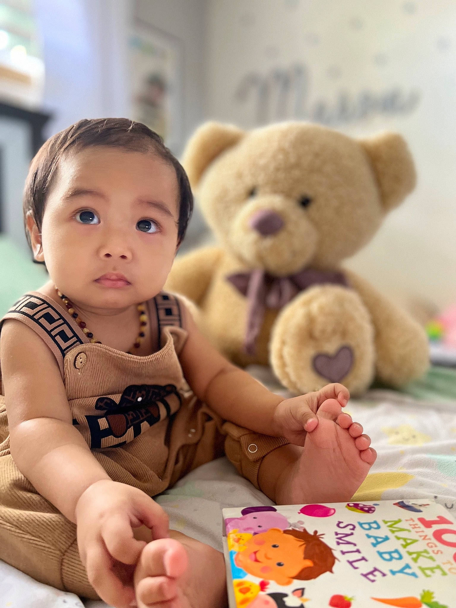 Mason is registered to the contest to win money with this photo: baby, baby_toddler_clothing, baby_toys, cheek, child, fun, fur, hand, happy, nose, person, plush, product, room, sitting, skin, stuffed_toy, teddy_bear, textile, toddler