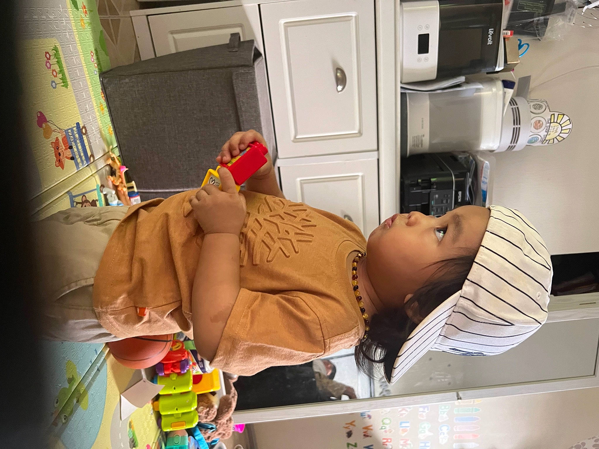 Mason joined the competition — help win amazing prizes! abdomen, cabinetry, cardboard, chest_of_drawers, child, comfort, drawer, headwear, human_leg, machine, major_appliance, person, refrigerator, room, service, visual_arts