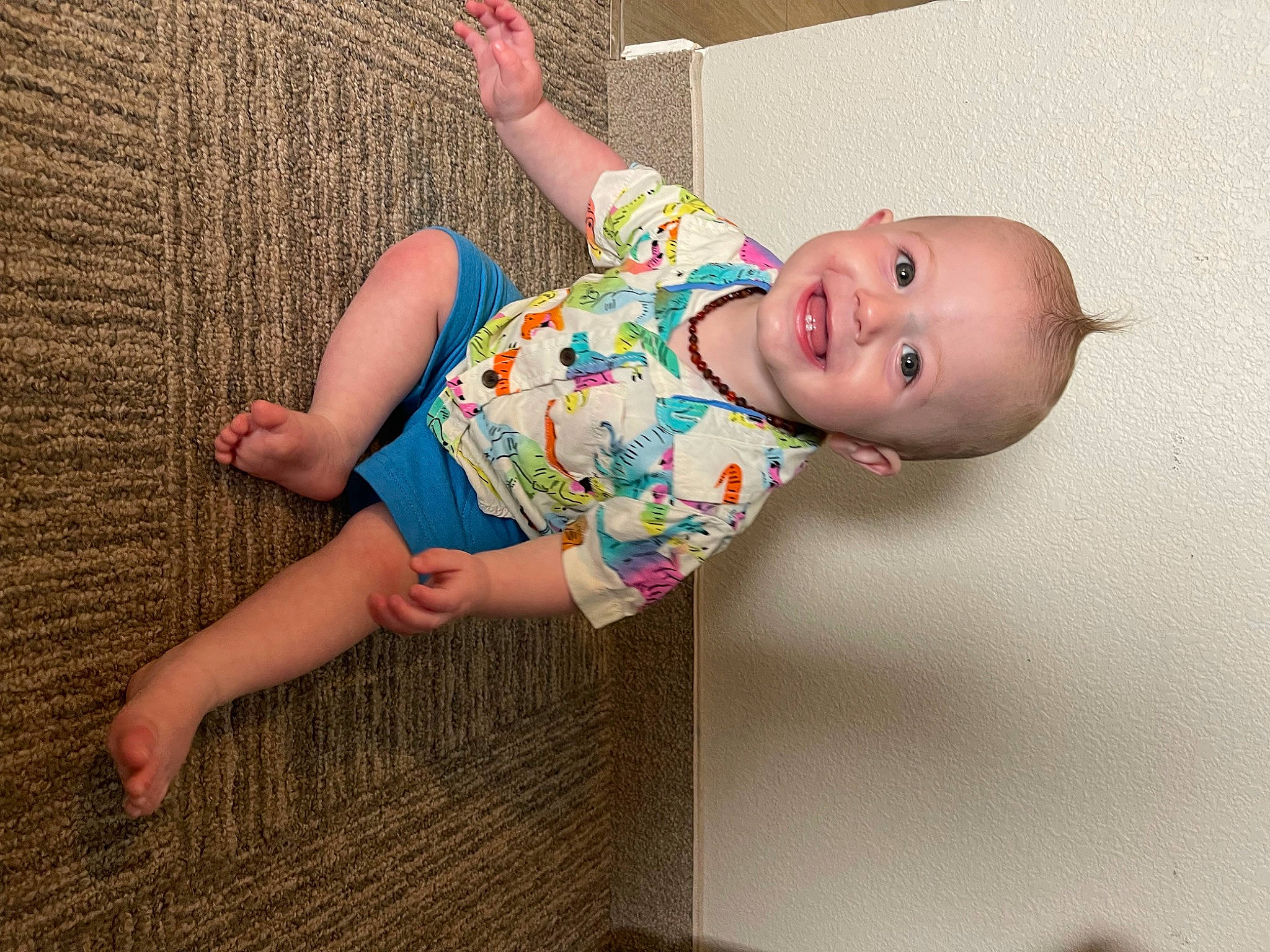 Everett is registered to the contest to win money with this photo: baby, baby_toddler_clothing, cheek, child, finger, foot, fun, happy, human_body, human_leg, joy, leg, pattern, person, pink, skin, sleeve, smile, textile, thigh