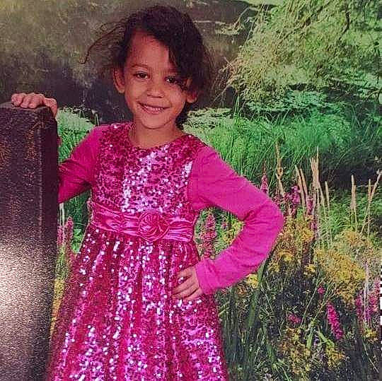 Alyssa is registered to the contest to win money with this photo: child, clothing, dress, flower, fun, girl, grass, grass_family, happiness, joy, magenta, outerwear, person, pink, plant, purple, shrub, smile, standing, toddler