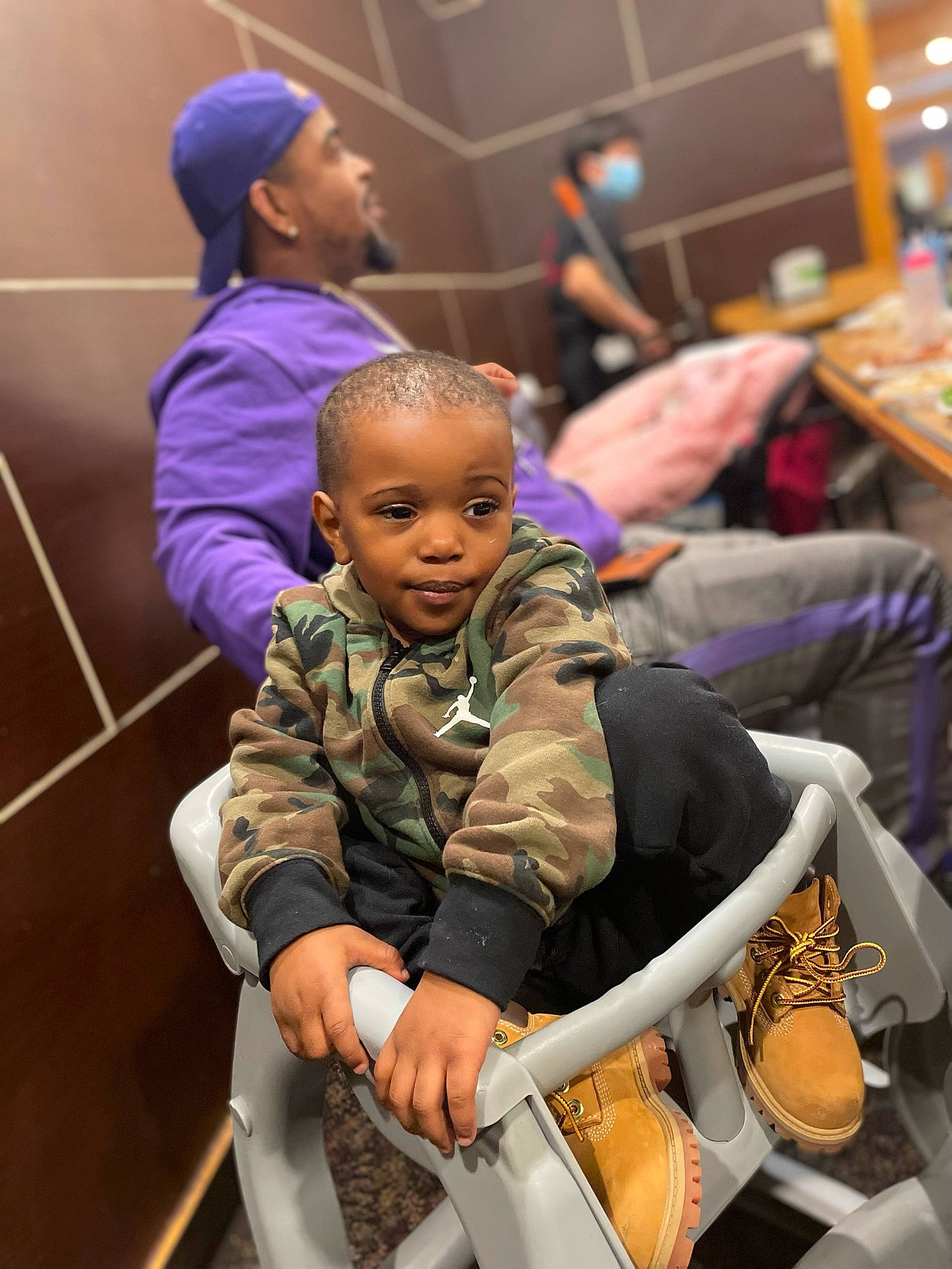 Dewayne is registered to the contest to win money with this photo: baby_products, bag, baseball_cap, cap, chair, child, event, fun, handbag, headwear, human, leisure, luggage_and_bags, magenta, military_uniform, person, purple, recreation, sitting, smile