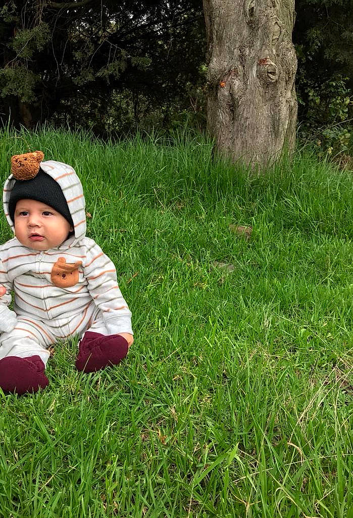 Zaid joined the competition — help win amazing prizes! baby, baby_toddler_clothing, child, garden, grass, grass_family, grassland, green, groundcover, happy, headwear, lawn, leaf, meadow, people_in_nature, person, plant, terrestrial_animal, toddler, tree