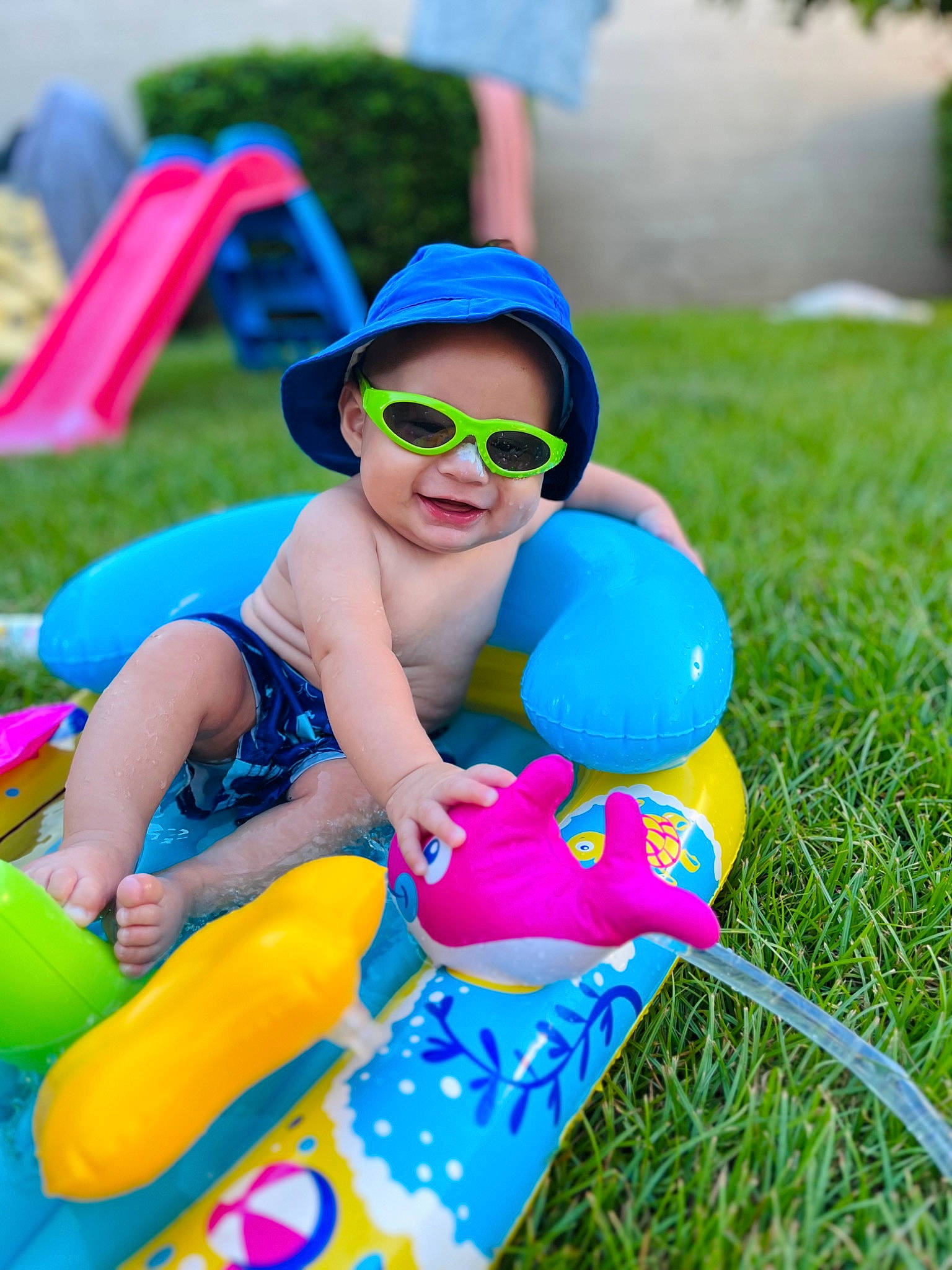 Zaid joined the competition — help win amazing prizes! baby_toddler_clothing, blue, child, electric_blue, event, eyewear, fun, goggles, grass, happy, hat, joy, leisure, people_in_nature, person, personal_protective_equipment, play, recreation, sitting, sunglasses