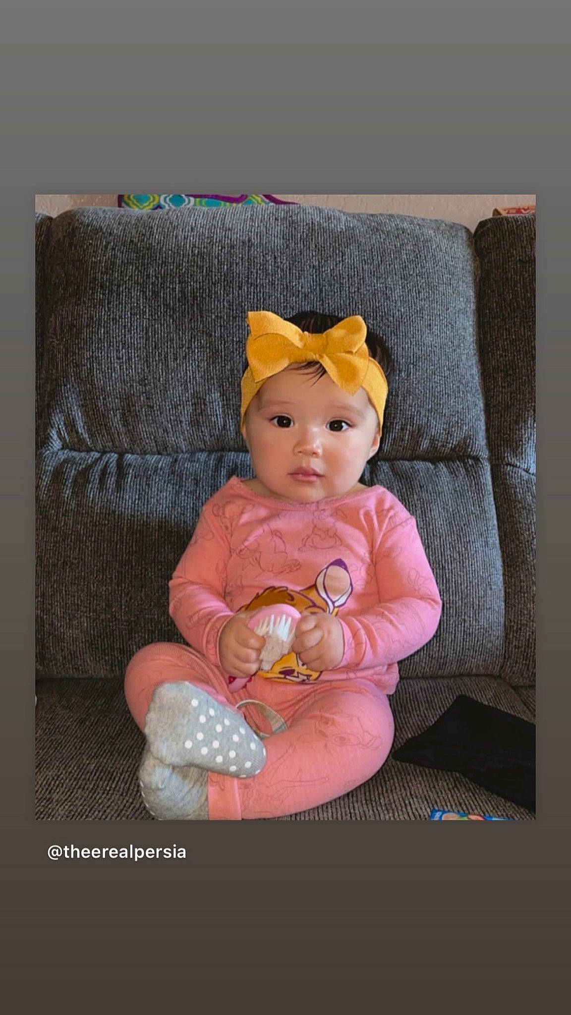 Laylani joined the competition — help win amazing prizes! baby, baby_products, baby_toddler_clothing, baby_toys, comfort, couch, headwear, lap, linens, magenta, peach, person, plush, product, rectangle, room, sitting, sleeve, stuffed_toy, toddler