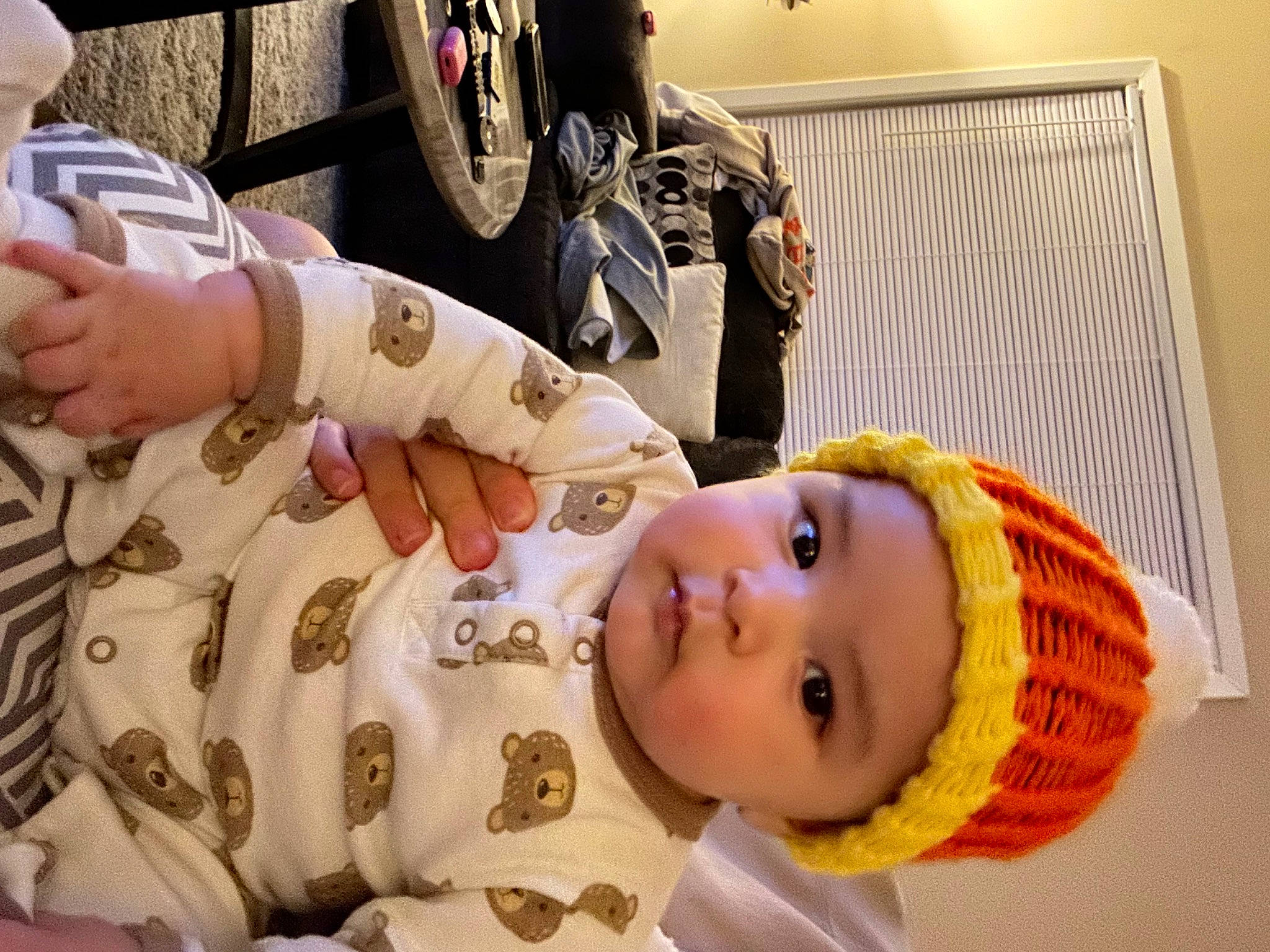 Nakoa is registered to the contest to win money with this photo: automotive_tire, baby, child, fun, gesture, happy, headwear, human_leg, motorcycle, nail, person, picture_frame, room, smile, thumb, tire, toddler, wheel, wrist