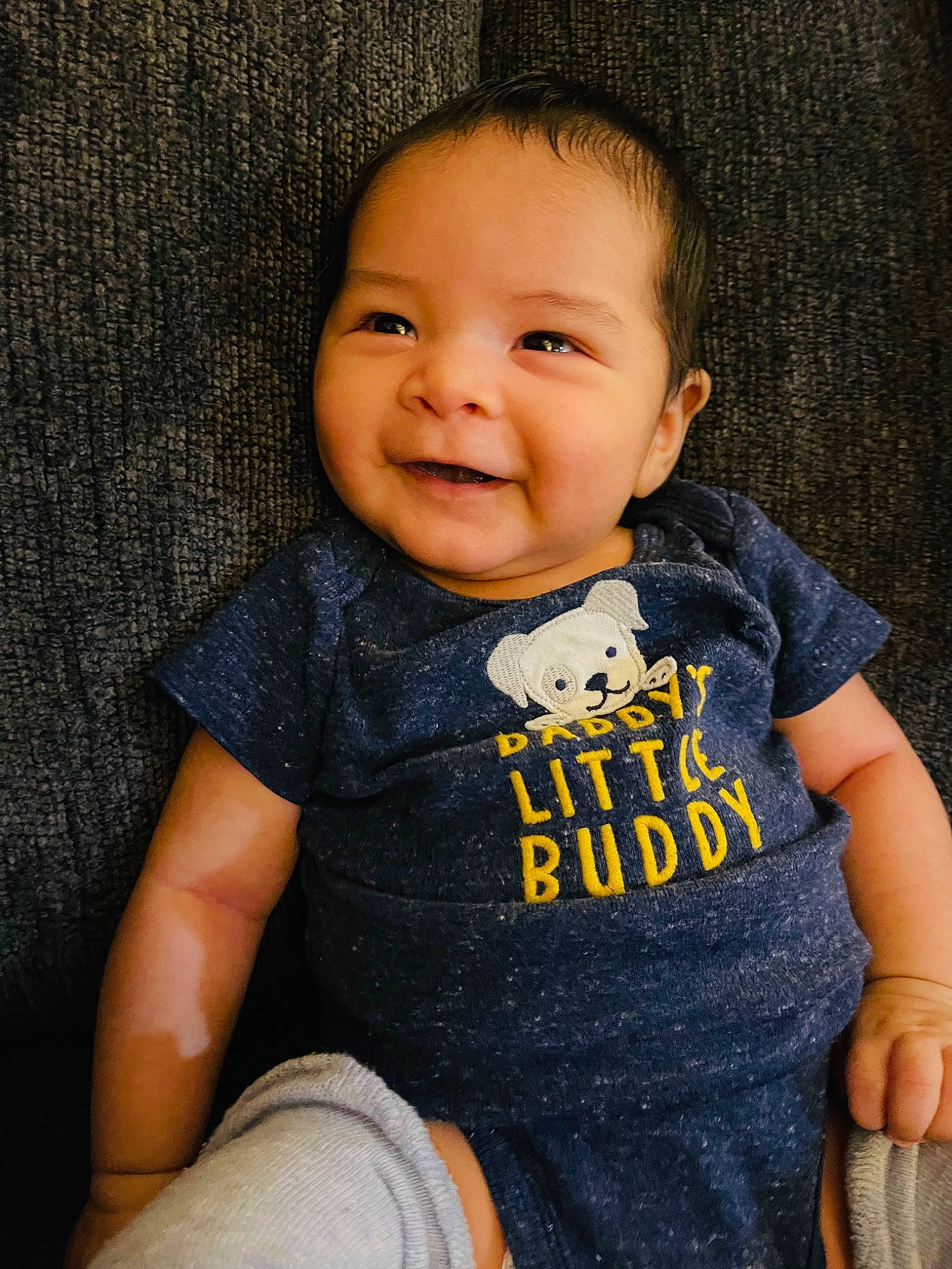 Nakoa joined the competition — help win amazing prizes! baby, baby_toddler_clothing, cheek, child, face, flash_photography, grey, happy, human_leg, iris, joy, lip, neck, pattern, person, sitting, skin, sleeve, smile, t_shirt