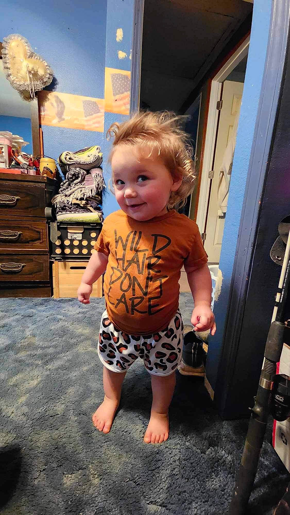 Harper is registered to the contest to win money with this photo: baby, barefoot, cabinetry, chest, chest_of_drawers, child, drawer, dresser, eye, flooring, foot, fun, human_leg, joy, person, room, sandal, sitting, thigh, toddler