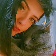 Alex is registered to the contest to win money with this photo: affection, calm, cat, closeup, cozy, domestic, face, feline, gray_cat, hair, human, indoor, intimate, love, pet, portrait, red_sweater, snuggling, warmth, woman