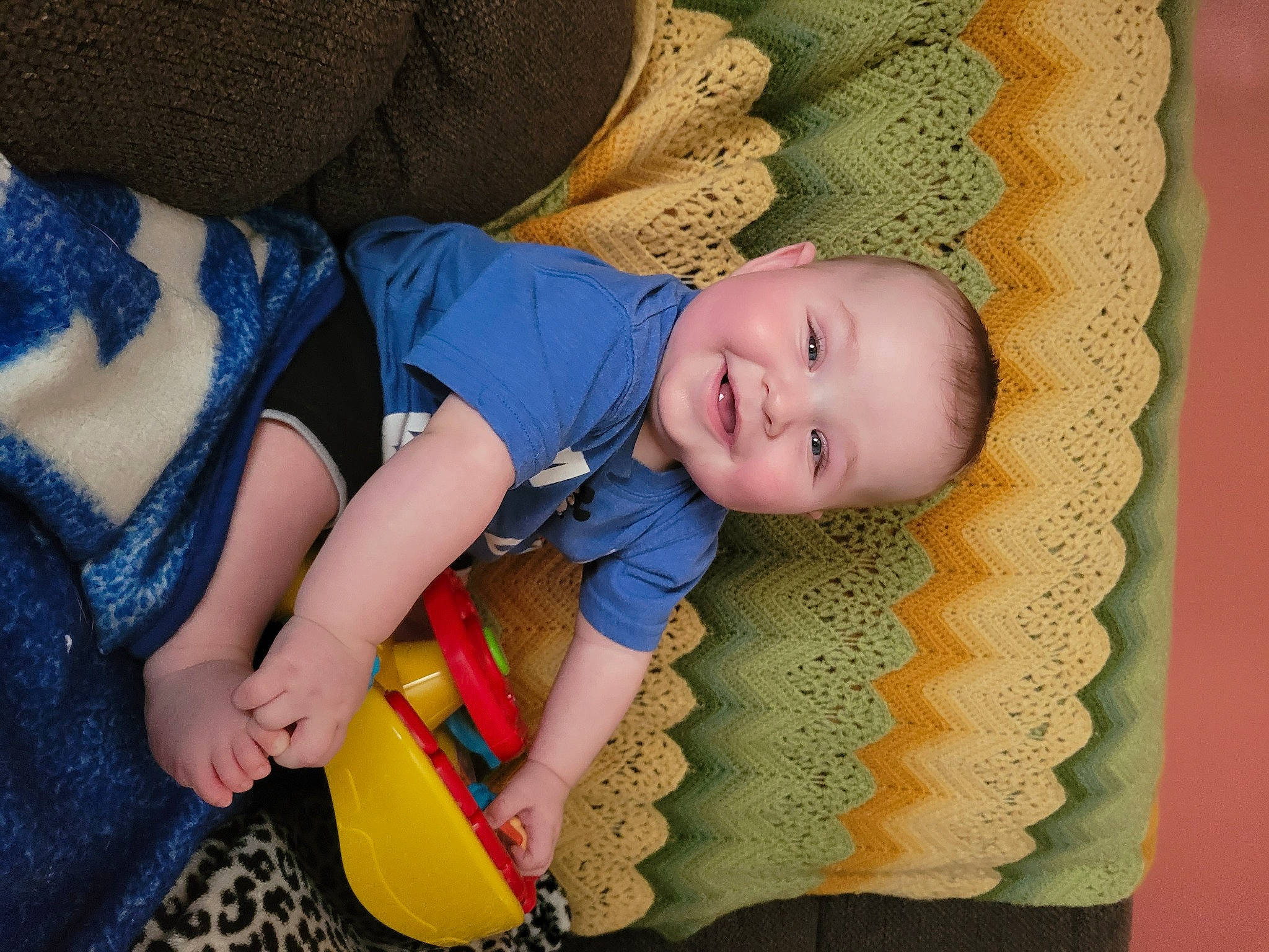 Connor joined the competition — help win amazing prizes! baby, baby_products, baby_toddler_clothing, cheek, child, comfort, finger, fun, happy, joy, linens, pattern, person, product, sitting, skin, sleeve, smile, textile, toddler