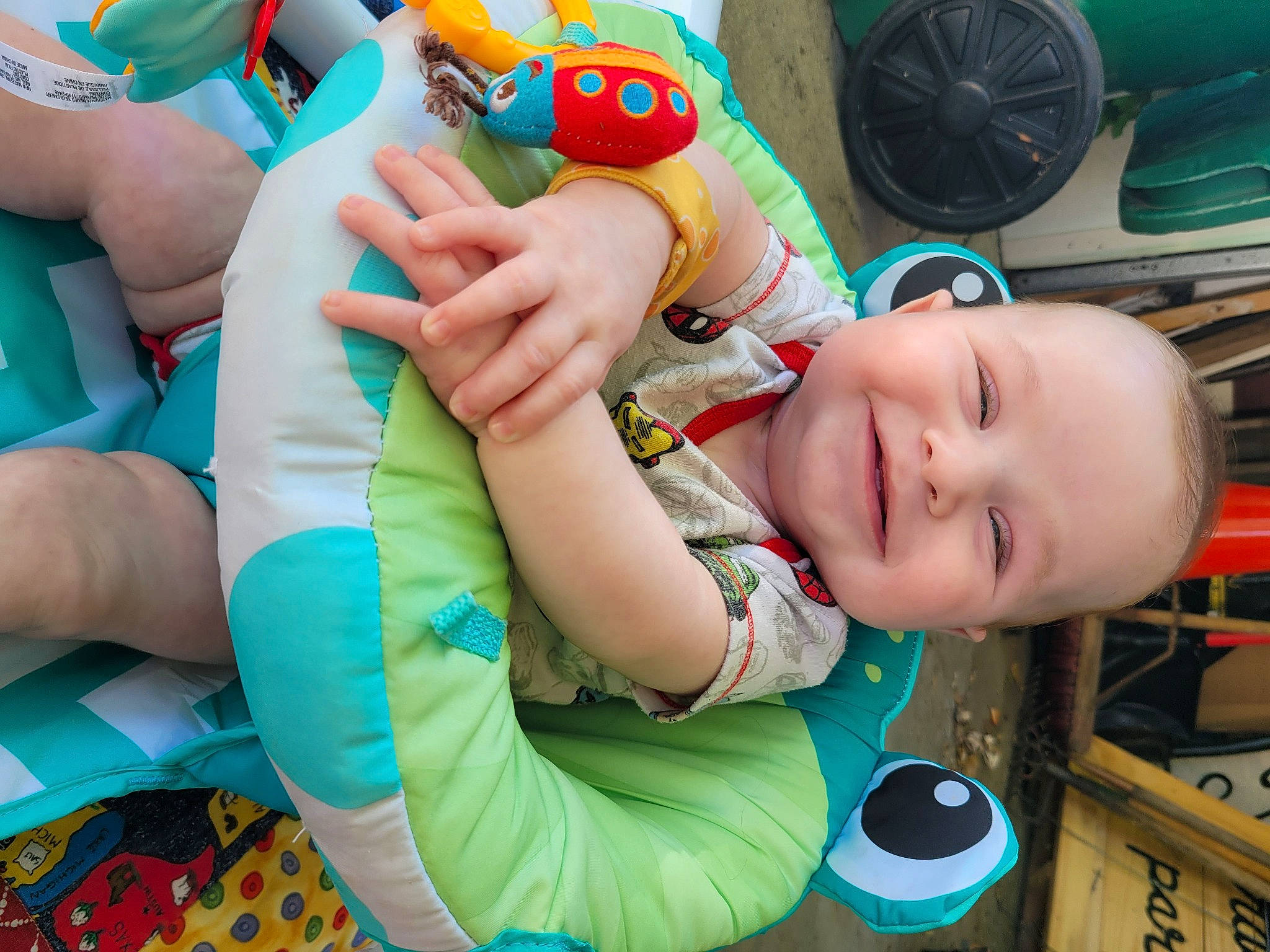 Connor is registered to the contest to win money with this photo: baby, baby_playing_with_toys, baby_products, baby_toddler_clothing, blue, child, finger, fun, green, happy, joy, leisure, mouth, nail, person, play, product, smile, stuffed_toy, thumb