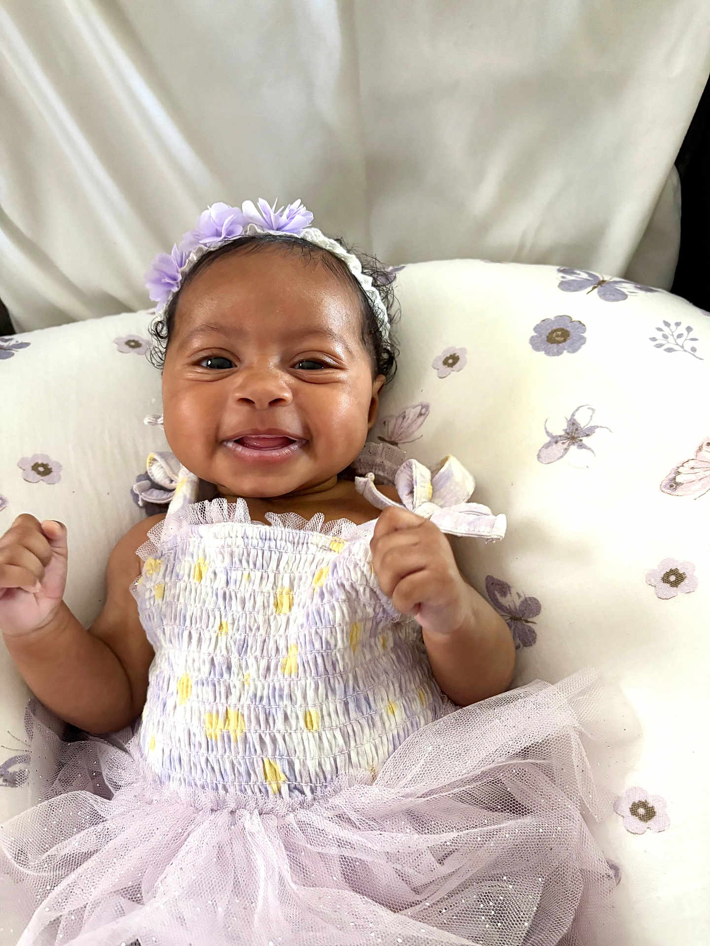 Ekho joined the competition — help win amazing prizes! baby, smiling, tutu, headband, flower, infant, cute, happy, child, portrait, purple, dress, cushion, pattern, person, lying_down, indoors, skin, hand, toddler