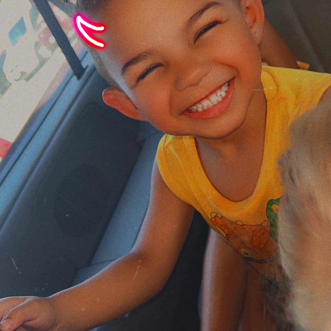 Makai is registered to the contest to win money with this photo: accessories, bodypart, child, clothing, cushion, face, female, girl, happy, head, homedecor, laughing, mouth, person, photography, portrait, smile, t_shirt, teeth, transportation