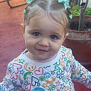 Sophie joined the competition — help win amazing prizes! big_eyes, child, cute, earrings, face, flowers, girl, hair_bows, hearts, outdoor, patio, patterned_clothing, pigtails, portrait, potted_plant, red_floor, smile, stars, sweater, toddler