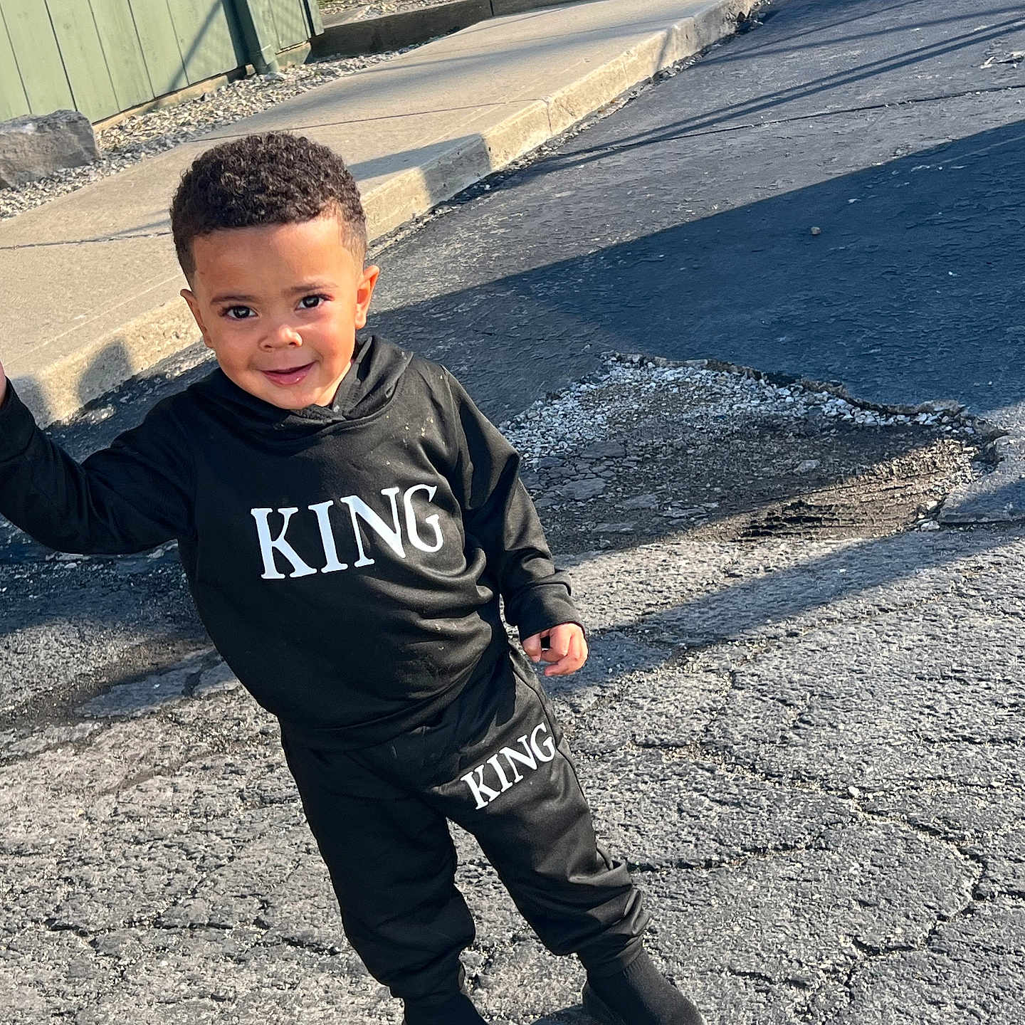 Jaziel is registered to the contest to win money with this photo: bodypart, boy, child, city, clothing, face, finger, head, longsleeve, male, pants, path, person, photography, portrait, road, sleeve, street, t_shirt, urban