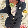 baby, newborn, pacifier, sleeping, onesie, nike, blanket, floral, infant, cozy, cute, soft, pink, foot, hand, clothing, face, person, indoors, rest
