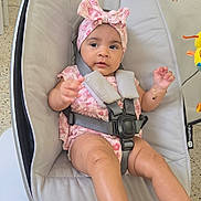 Kimberly joined the competition — help win amazing prizes! baby, infant, child, headband, pink, floral, baby_rocker, seatbelt, indoor, curious, cute, legs, barefoot, bracelet, fabric, modern, furniture, floor, expression, portrait