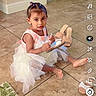 child, toddler, girl, dress, pink, white, sitting, indoor, tile_floor, toy, wooden_toy, sandals, hair_bows, portrait, looking_at_camera, home, dining_area, rug, social_media_screenshot, smartphone_interface