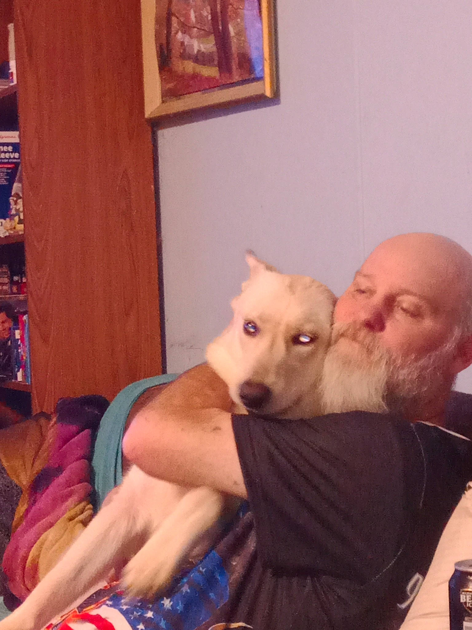 Snowball is registered to the contest to win money with this photo: abdomen, arm, barechested, beard, carnivore, chest, comfort, companion_dog, dog, dog_breed, fawn, felidae, jaw, kiss, neck, picture_frame, shoulder, small_to_medium_sized_cats, trunk, whiskers