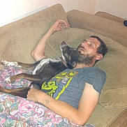 Nadda joined the competition — help win amazing prizes! arm, beard, blanket, brown, casual, comfort, companion, couch, dog, floral_pattern, furniture, home, human, indoor, man, pet, relaxing, resting, sleeping, tshirt