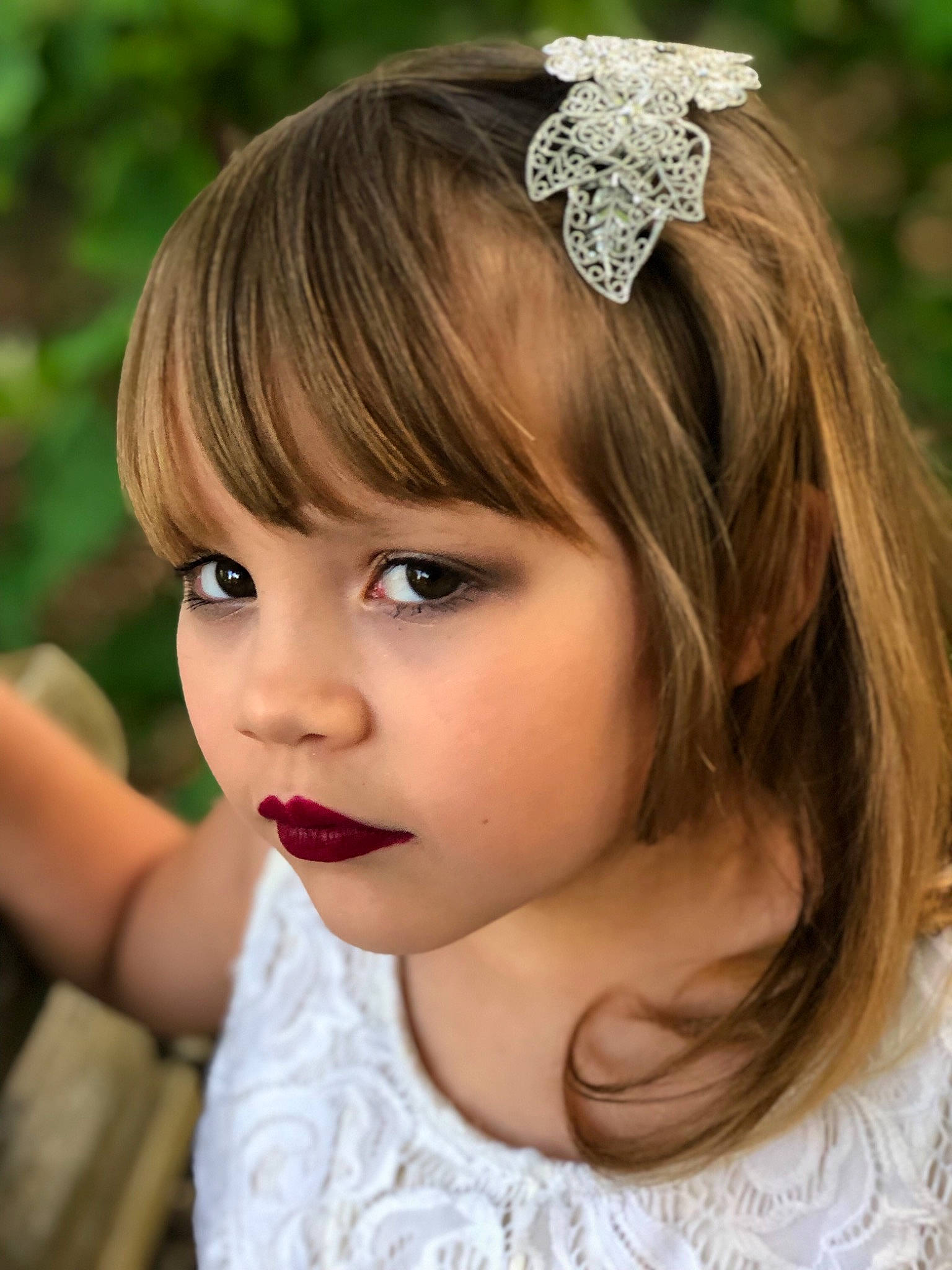 Justice is registered to the contest to win money with this photo: bangs, bridal_accessory, brown_hair, child, child_model, clothing, crown, fashion_accessory, flower_girl, hair, hair_accessory, hair_tie, hairstyle, headband, headgear, headpiece, jewellery, lip, long_hair, person