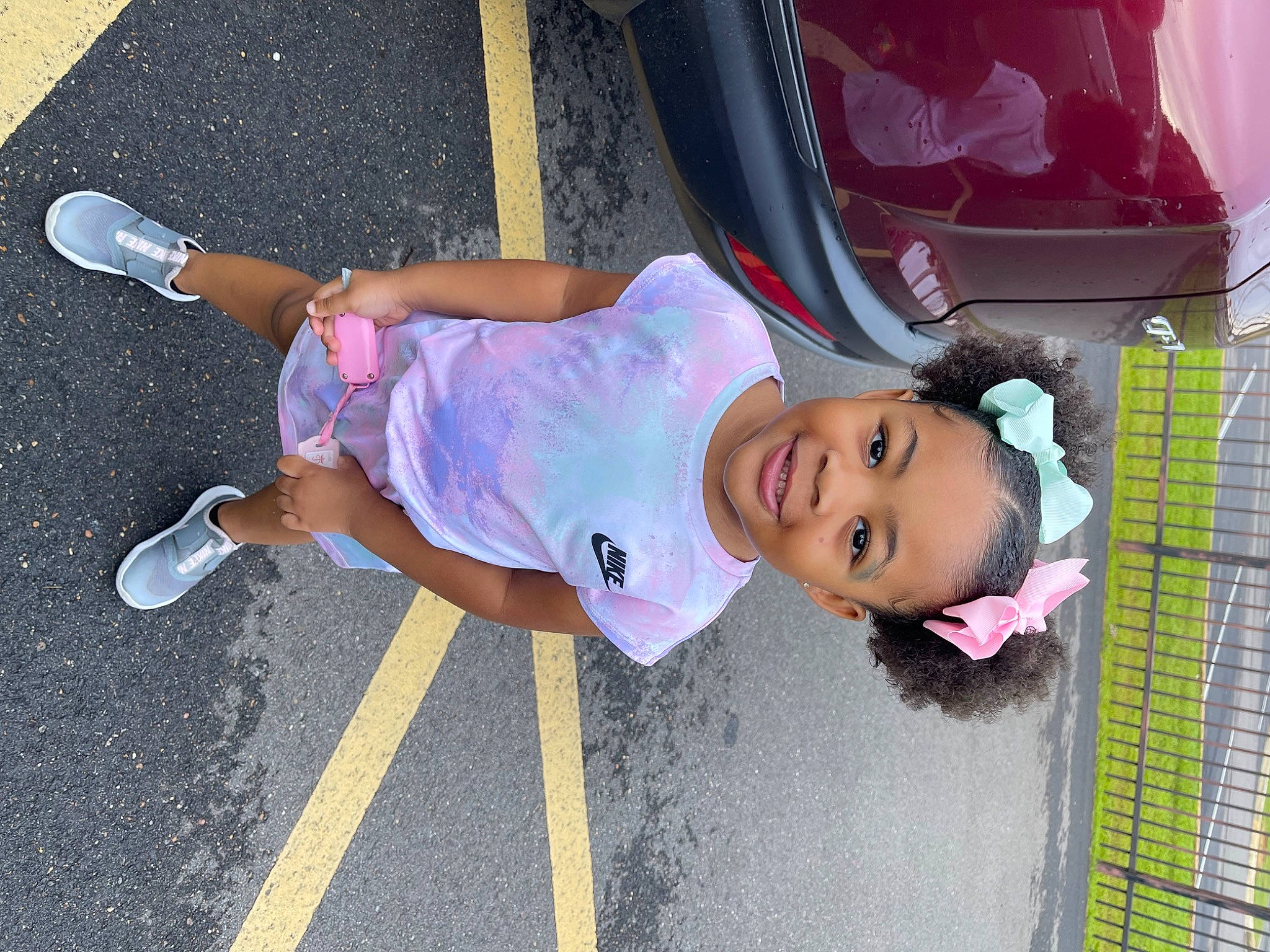 Chloe Nevaeh joined the competition — help win amazing prizes! asphalt, automotive_lighting, child, electric_blue, fun, happy, hat, human_leg, joy, leisure, magenta, person, pink, purple, sidewalk, smile, tire, toddler, trunk, vehicle_door