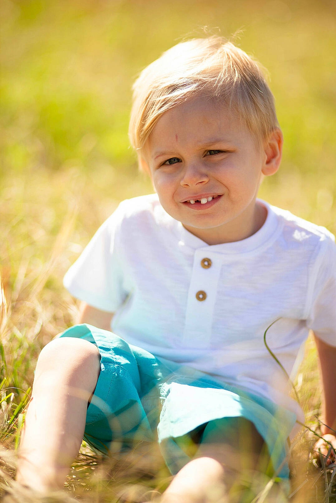 Rylyn is registered to the contest to win money with this photo: baby, baby_toddler_clothing, blond, eye, face, flash_photography, fun, grass, grass_family, grassland, happy, iris, joy, leisure, meadow, people_in_nature, person, plant, skin, smile